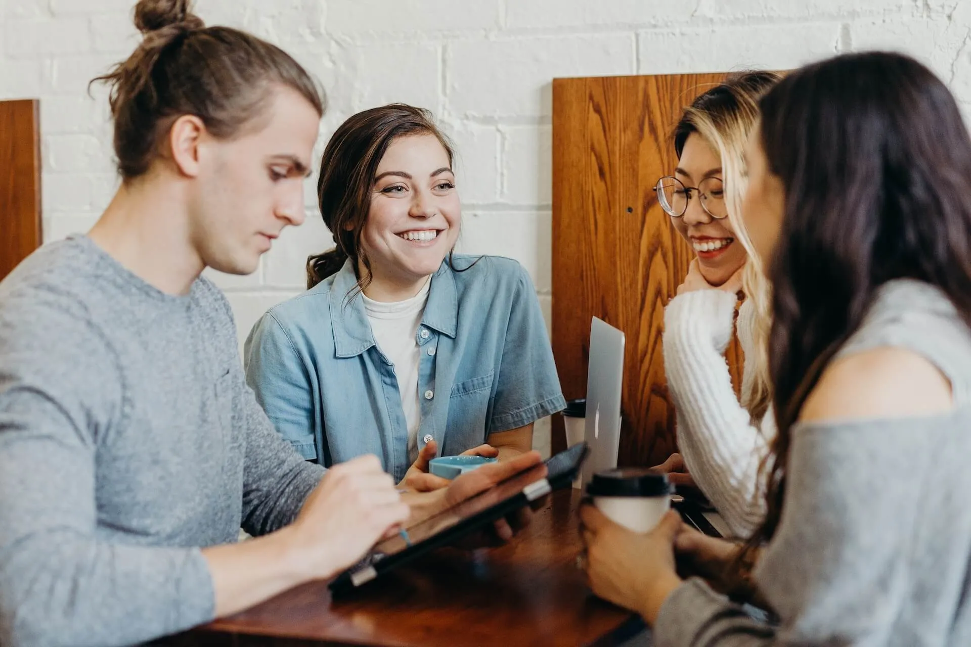 group of your men and women networking at a cafe